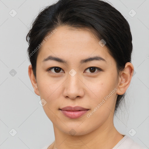 Joyful asian young-adult female with short  brown hair and brown eyes