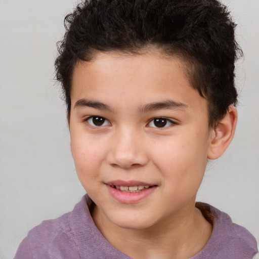 Joyful white child male with short  brown hair and brown eyes