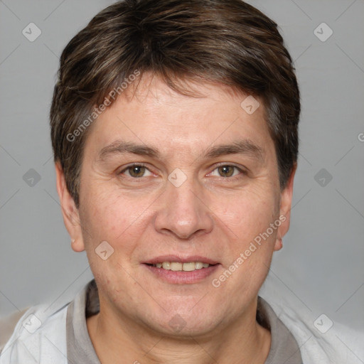 Joyful white adult male with short  brown hair and brown eyes