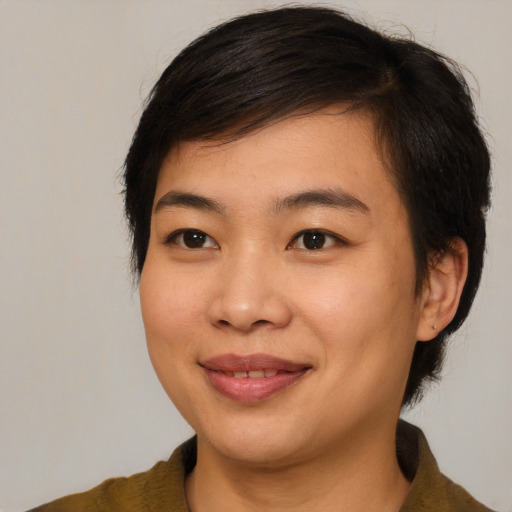 Joyful asian young-adult female with medium  brown hair and brown eyes