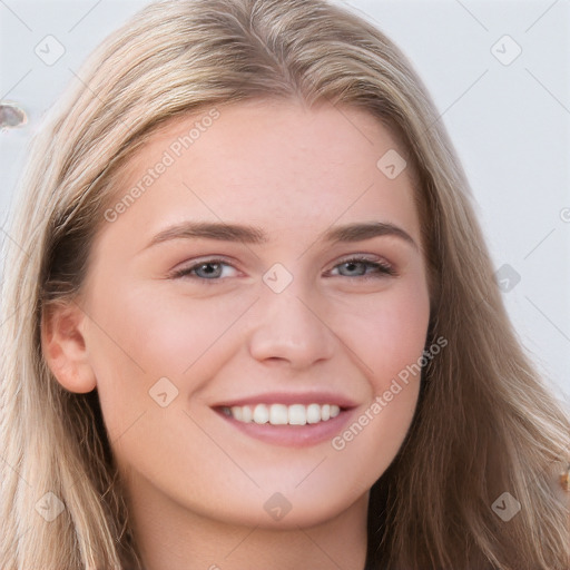 Joyful white young-adult female with long  brown hair and blue eyes