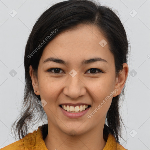 Joyful latino young-adult female with medium  brown hair and brown eyes