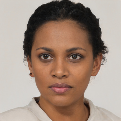 Neutral black young-adult female with short  black hair and brown eyes