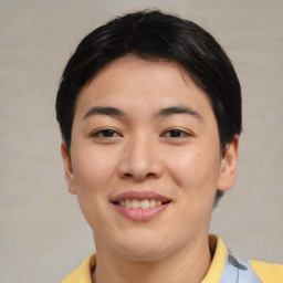 Joyful asian young-adult female with short  brown hair and brown eyes