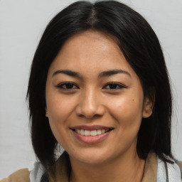 Joyful asian young-adult female with medium  brown hair and brown eyes