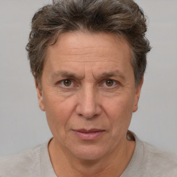 Joyful white middle-aged male with short  brown hair and brown eyes