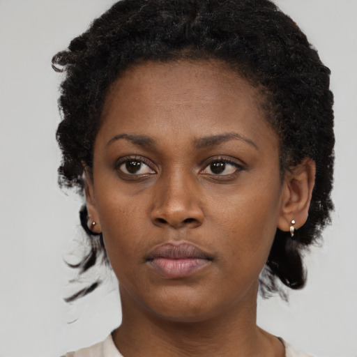 Neutral black young-adult female with short  brown hair and brown eyes