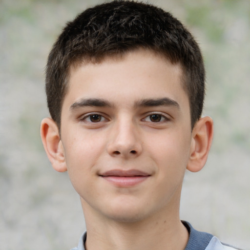 Joyful white child male with short  brown hair and brown eyes