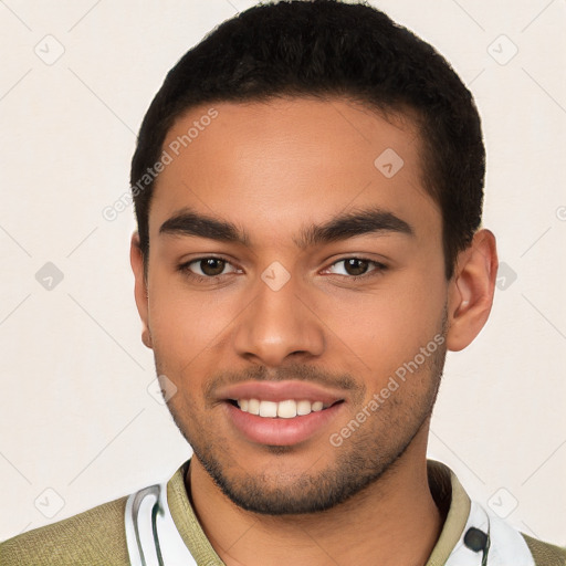 Joyful latino young-adult male with short  black hair and brown eyes