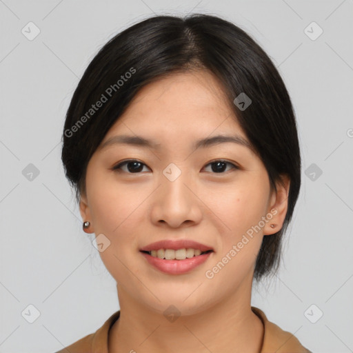 Joyful asian young-adult female with medium  black hair and brown eyes