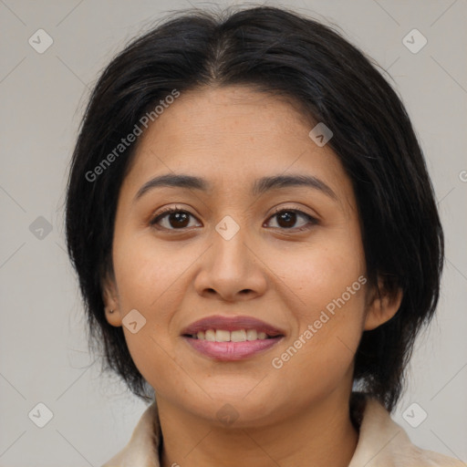 Joyful latino young-adult female with medium  brown hair and brown eyes