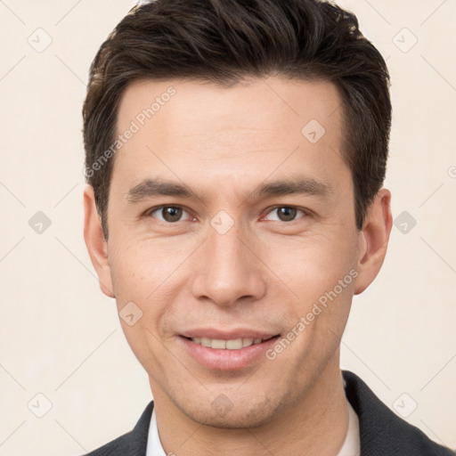 Joyful white young-adult male with short  brown hair and brown eyes