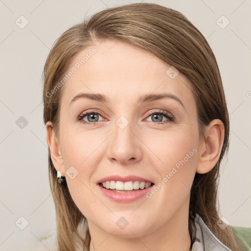 Joyful white young-adult female with medium  brown hair and grey eyes