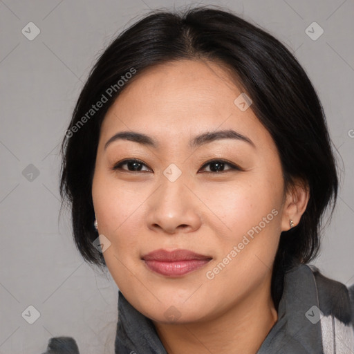 Joyful asian young-adult female with medium  black hair and brown eyes