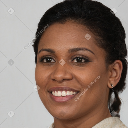 Joyful black young-adult female with short  brown hair and brown eyes