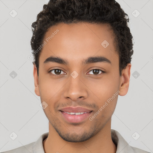 Joyful latino young-adult male with short  brown hair and brown eyes