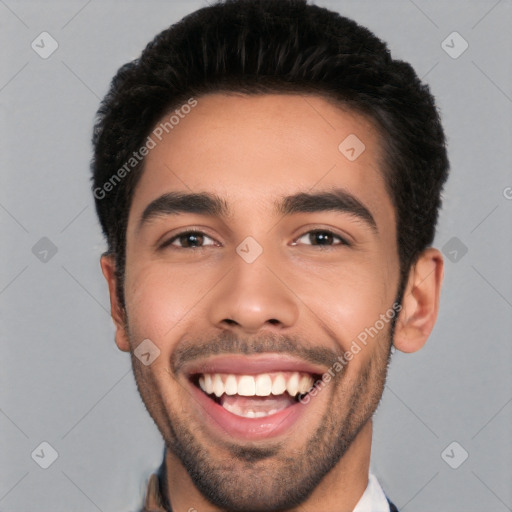 Joyful white young-adult male with short  black hair and brown eyes