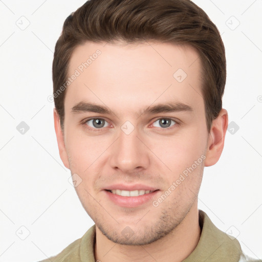 Joyful white young-adult male with short  brown hair and grey eyes