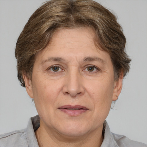 Joyful white middle-aged female with short  brown hair and brown eyes