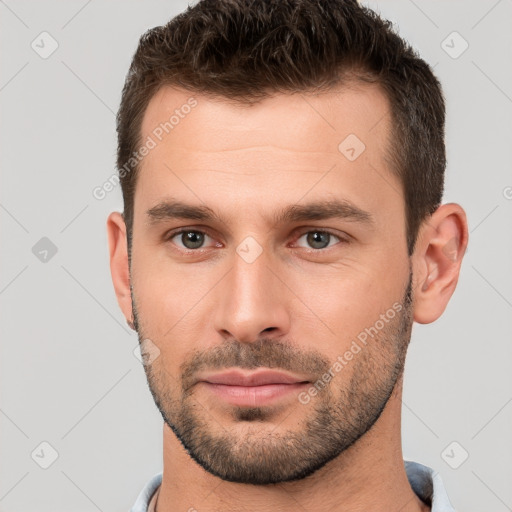 Neutral white young-adult male with short  brown hair and brown eyes