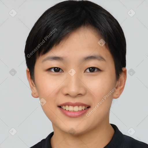 Joyful asian young-adult female with short  black hair and brown eyes