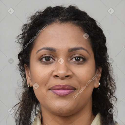 Joyful black young-adult female with long  brown hair and brown eyes