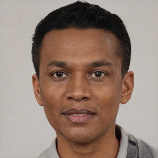 Neutral black young-adult male with short  black hair and brown eyes