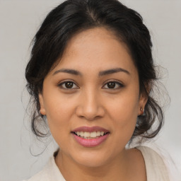 Joyful white young-adult female with medium  brown hair and brown eyes