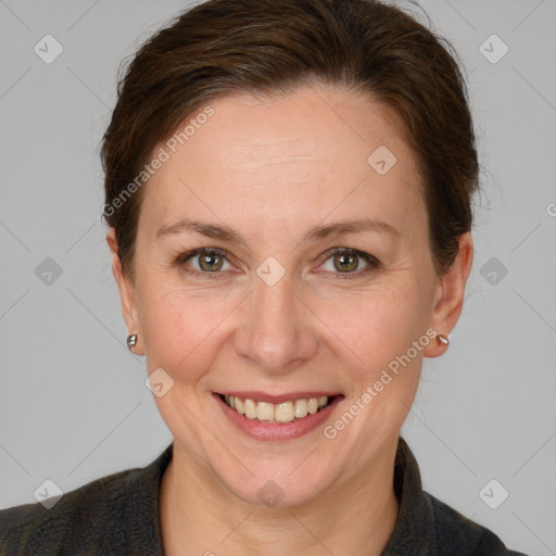 Joyful white adult female with short  brown hair and grey eyes