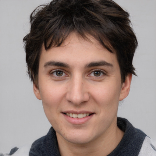 Joyful white young-adult male with medium  brown hair and brown eyes