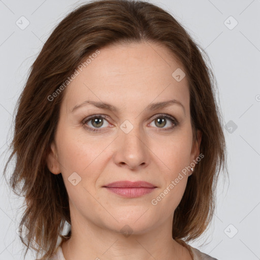 Joyful white young-adult female with medium  brown hair and green eyes