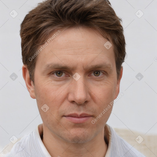 Joyful white adult male with short  brown hair and grey eyes