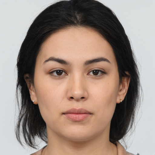 Neutral white young-adult female with medium  brown hair and brown eyes