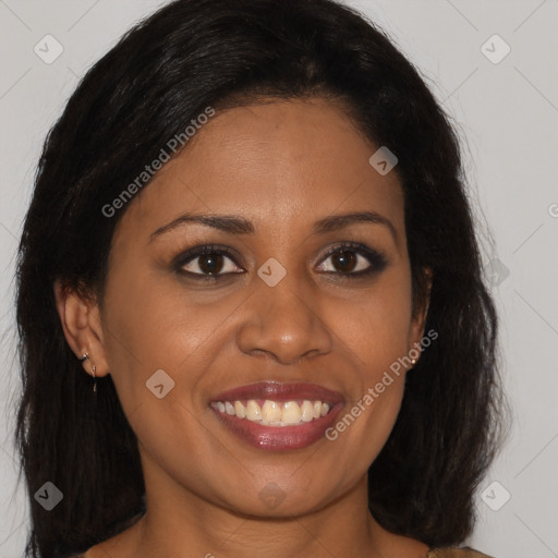 Joyful black young-adult female with long  brown hair and brown eyes