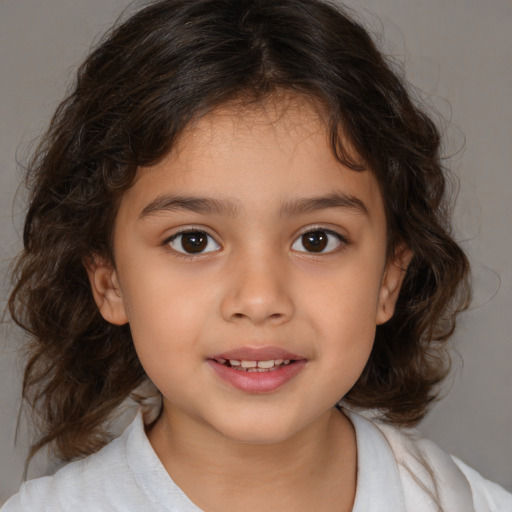 Joyful white child female with medium  brown hair and brown eyes