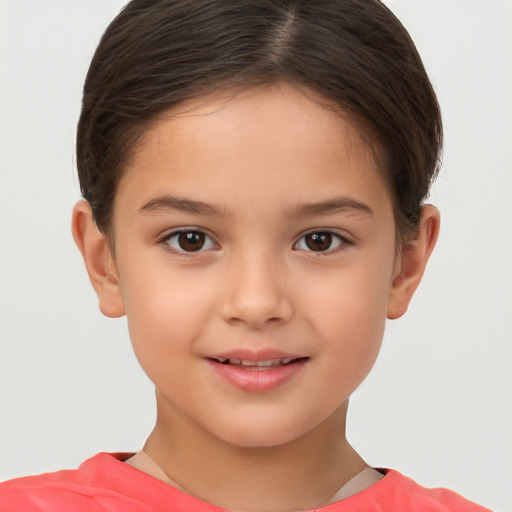 Joyful white child female with short  brown hair and brown eyes