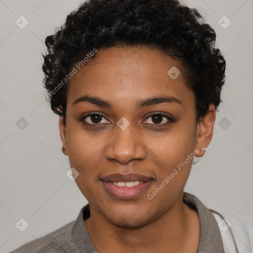 Joyful black young-adult female with short  black hair and brown eyes