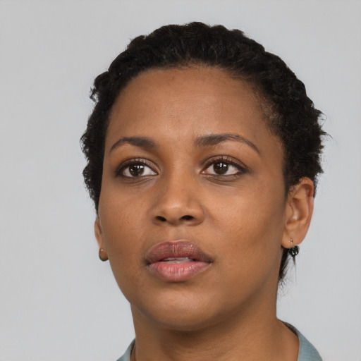 Neutral black young-adult female with short  black hair and brown eyes