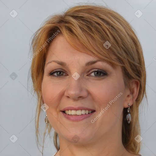 Joyful white adult female with medium  brown hair and brown eyes