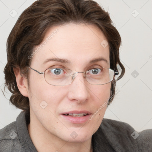 Joyful white adult female with medium  brown hair and blue eyes