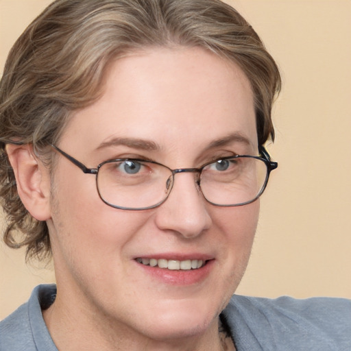 Joyful white adult female with short  brown hair and blue eyes