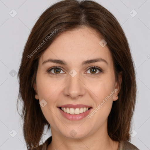 Joyful white young-adult female with long  brown hair and brown eyes