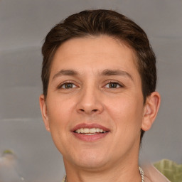 Joyful white adult male with short  brown hair and brown eyes