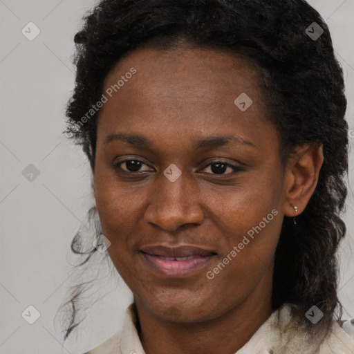 Joyful black adult female with short  brown hair and brown eyes