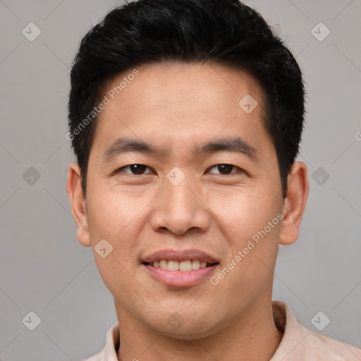 Joyful asian young-adult male with short  brown hair and brown eyes