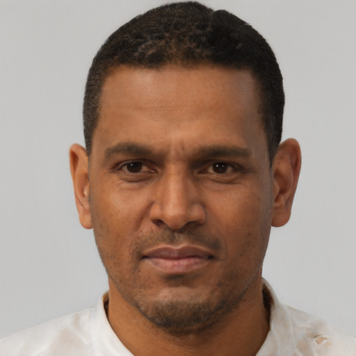 Neutral black adult male with short  brown hair and brown eyes