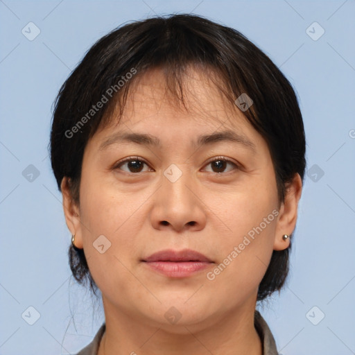 Joyful white adult female with short  brown hair and brown eyes