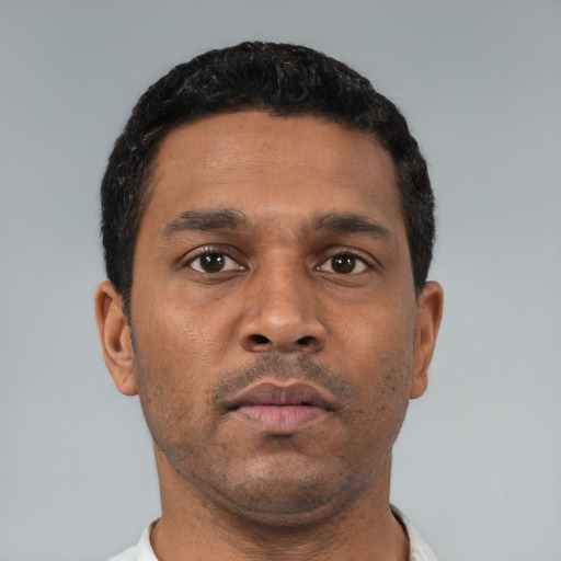 Neutral black young-adult male with short  black hair and brown eyes