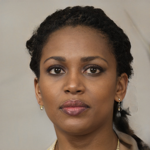 Neutral black young-adult female with short  black hair and brown eyes