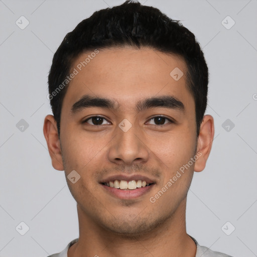 Joyful latino young-adult male with short  black hair and brown eyes